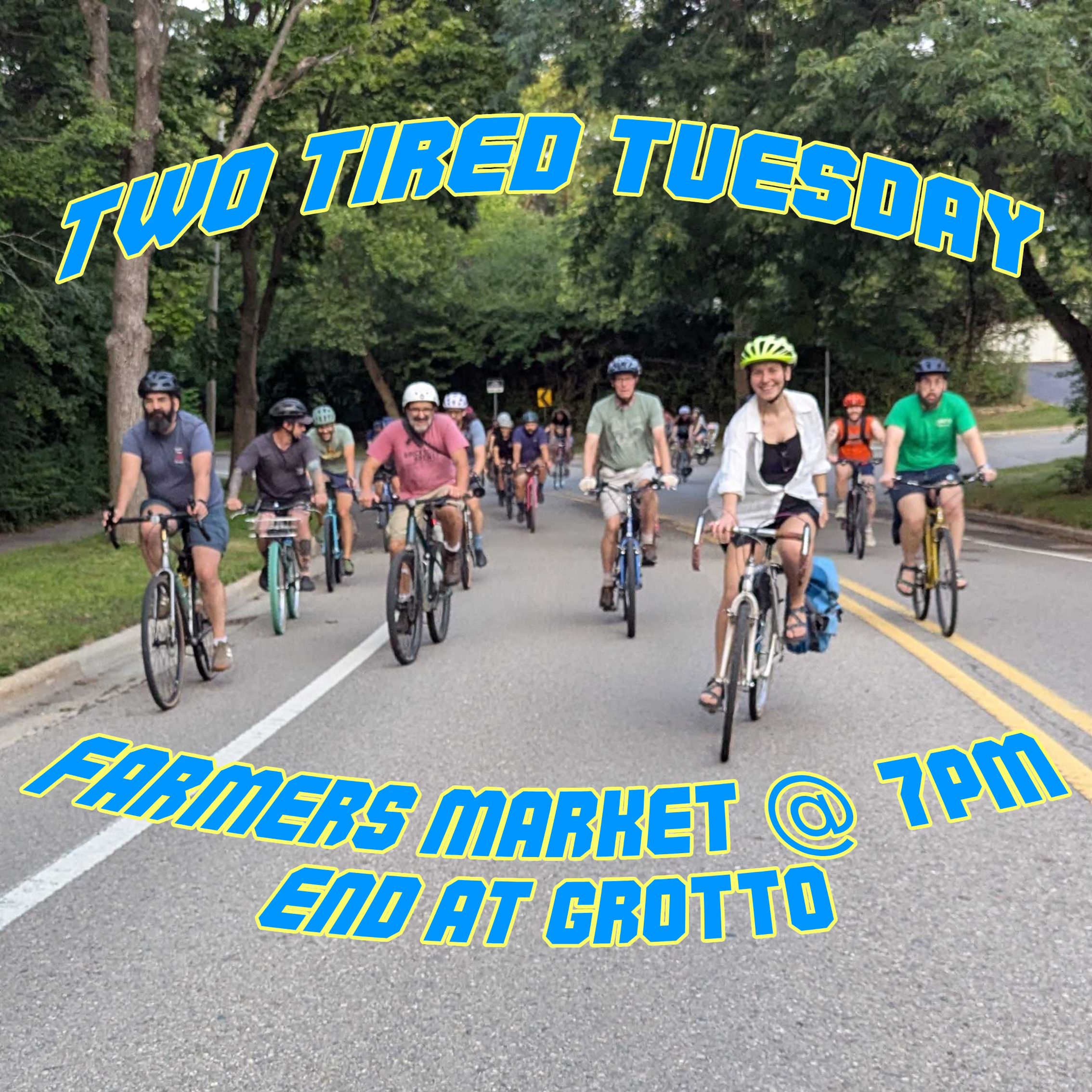 Two Tired Bicycle Club riders biking together on a tree-lined Ann Arbor street